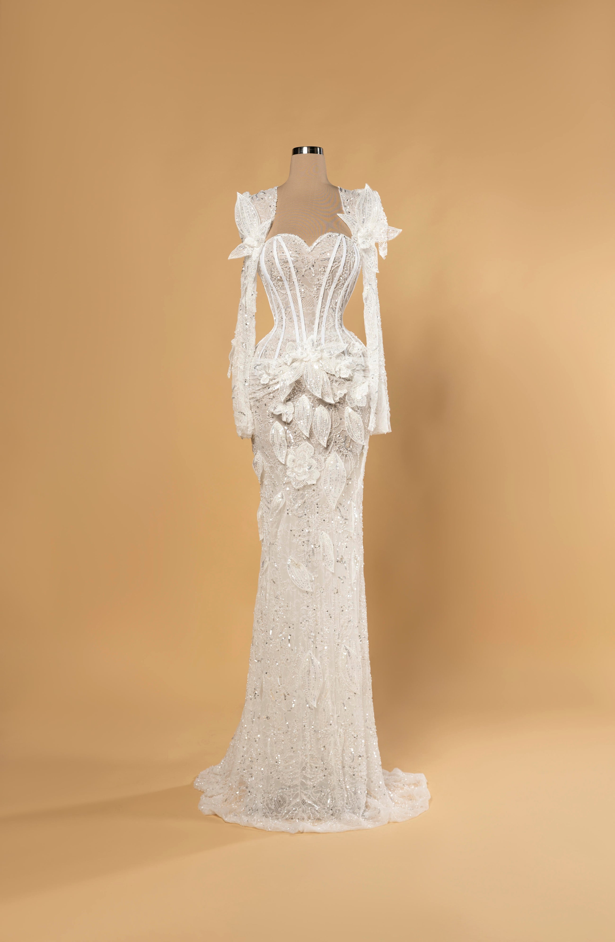 Sihëna Snowleaf Mosaic — ivory sweetheart long-sleeve mermaid bridal gown in lace and sequins with 3D-floral leaf appliqué and train.