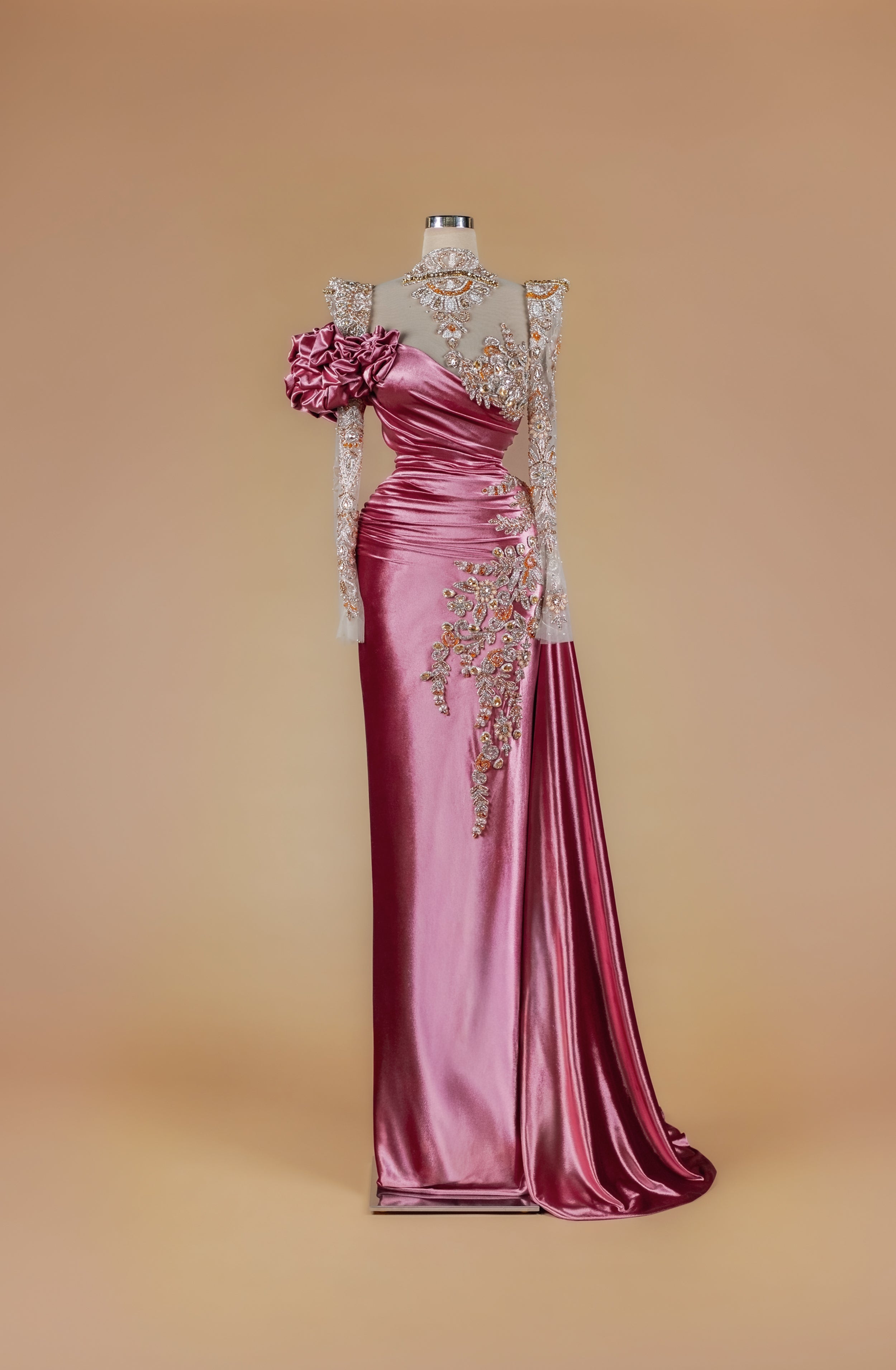 Sihëna Damask Rose Cascade — dusty-rose high-neck long-sleeve column gown with crystal-beaded sheer bodice, satin drape, 3D rosette and sash train.