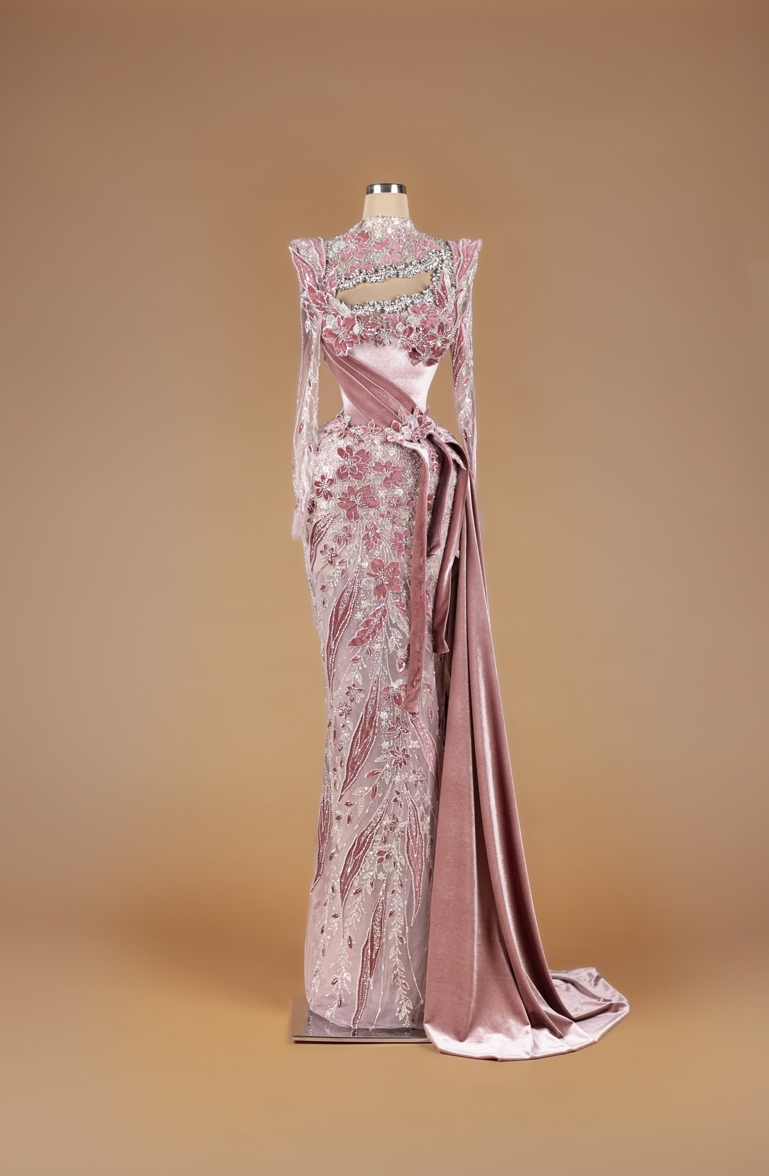 Sihëna Petal Script Sonata — dusty-rose high-neck long-sleeve mermaid gown with 3D floral velvet appliqué, crystal beadwork and draped velvet sash train.
