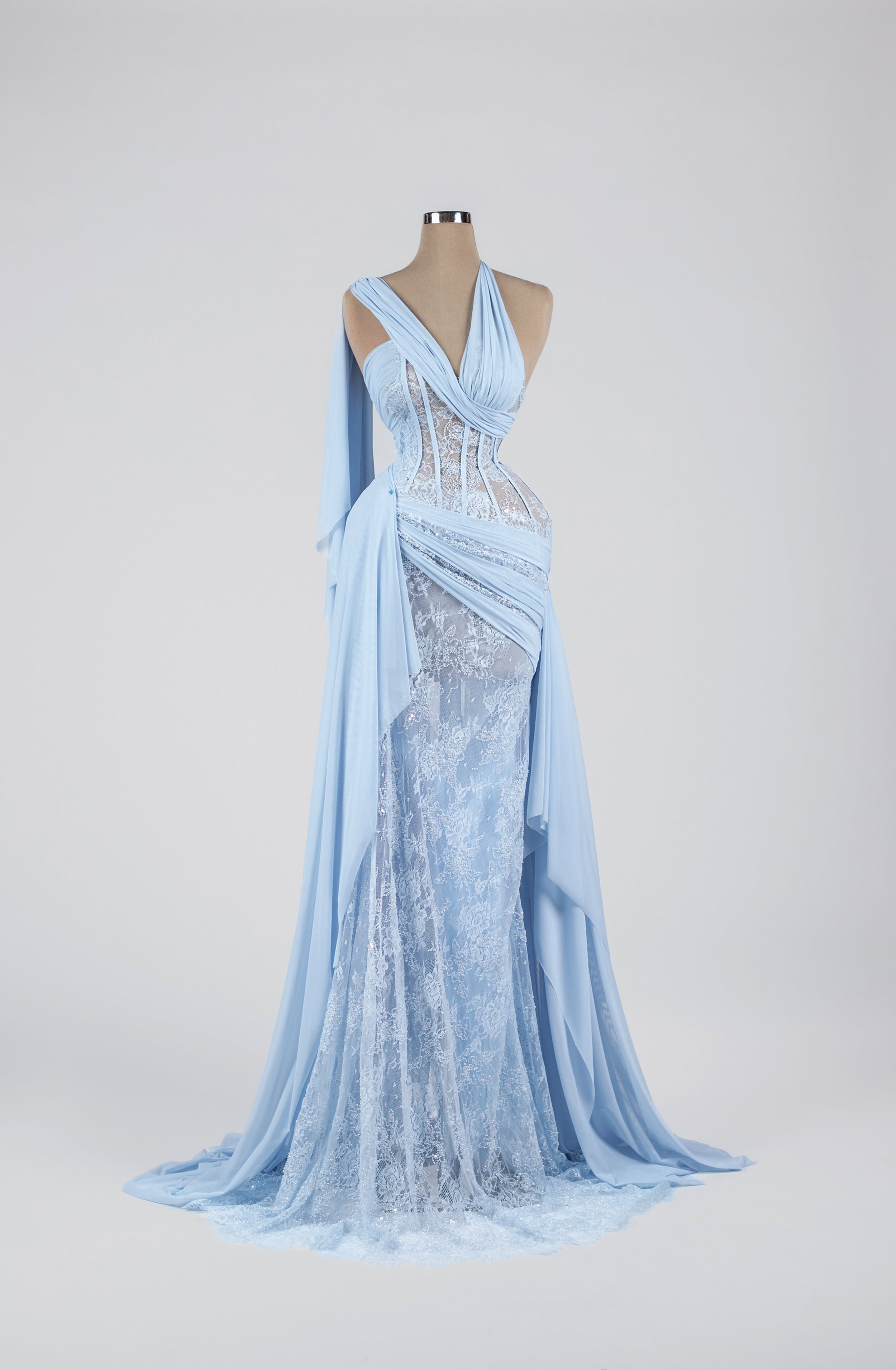 Sihëna Skyfall Lace Cascade — powder-blue halter lace mermaid gown with a sheer lace corset and draped chiffon sash.