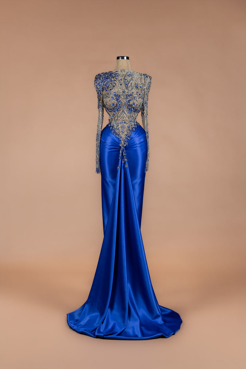 Sihëna Sapphire Regent — cobalt high-neck long-sleeve gown with sapphire-crystal illusion bodice and draped satin mermaid skirt.