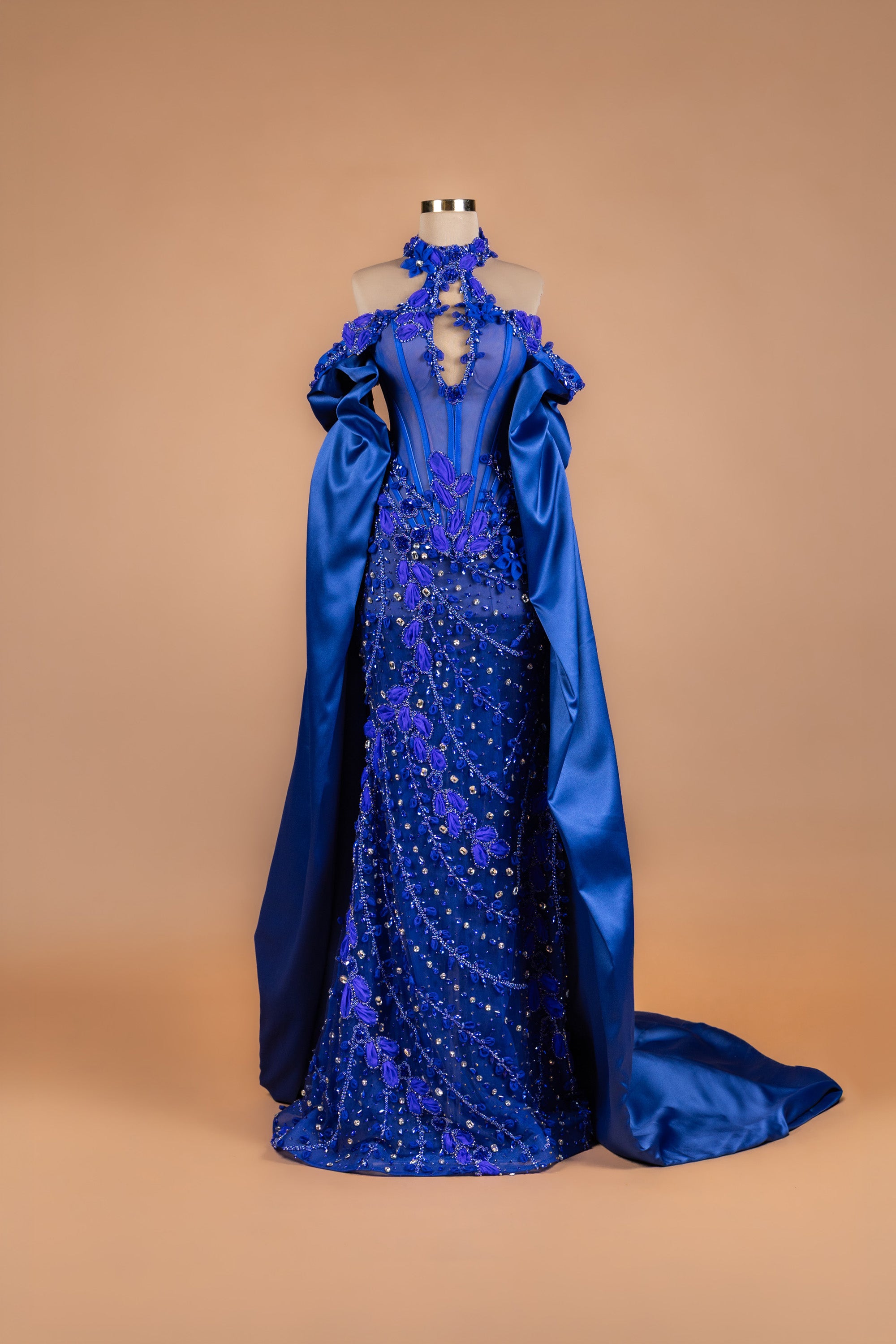 Sihëna Cobalt Petal Cascade — cobalt halter caped mermaid gown with satin cape, 3D petal florals and sheer boned corset bodice.