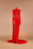 Sihëna Ruby Cage — red high-neck long-sleeve beaded-lace mermaid gown with caged corset waist, high slit and train.