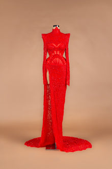 Sihëna Ruby Cage — red high-neck long-sleeve beaded-lace mermaid gown with caged corset waist, high slit and train.