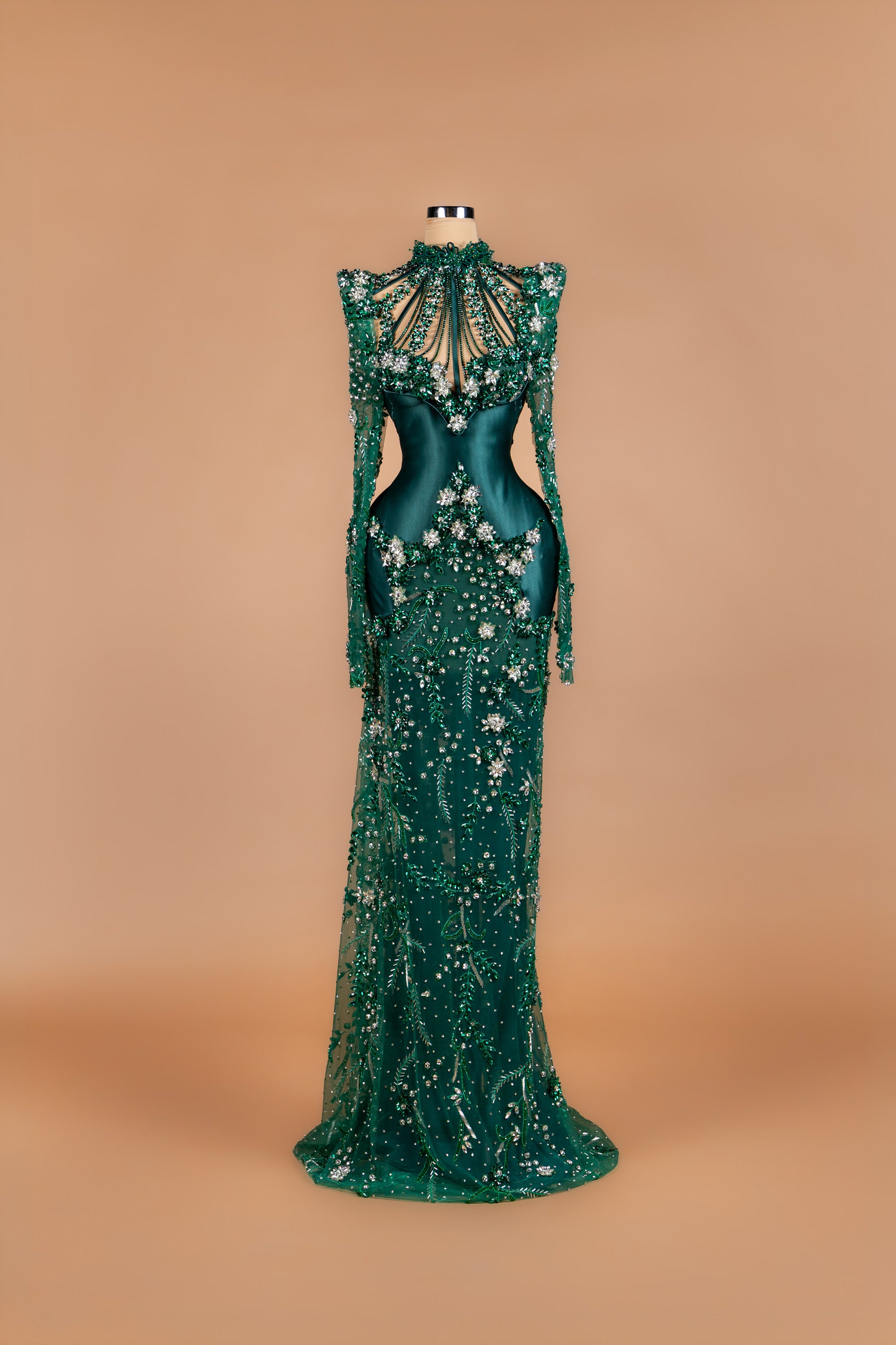 Sihëna Emerald Vine — emerald high-neck long-sleeve mermaid gown with satin bodice, caged beadwork and crystal florals.