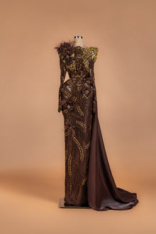 Sihëna Cocoa Bloom Reverie — chocolate high-neck long-sleeve mermaid gown with gold crystal beadwork, 3D florals and feather shoulder.