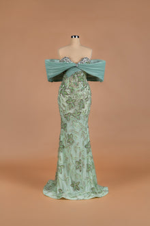 Sihëna Sage Blossom — sage-green off-shoulder mermaid gown with crystal sweetheart trim and beaded floral body.