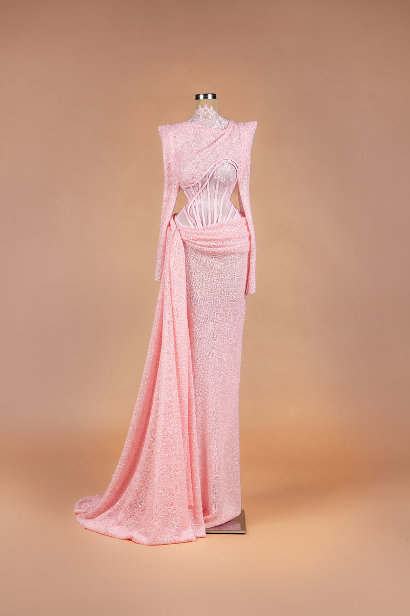 Sihëna Rosé Sugar — powder-pink high-neck long-sleeve sequin gown with sheer lace corset midriff and draped sash.