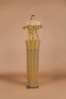 Sihëna Golden Cascade — gold off-shoulder column gown with crystal floral bodice and cascading beaded fringe skirt.