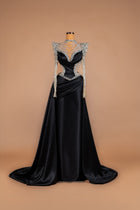 Sihëna Obsidian Throne — black high-neck long-sleeve satin mermaid gown with crystal illusion yoke, corset bodice and draped train.