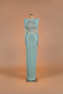 Sihëna Seafoam Mist — mint high-neck long-sleeve sheer-mesh column gown with crystal heart-motif trim and keyhole cutout.