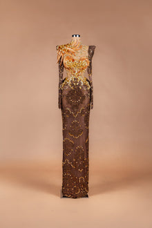 Sihëna Autumn Phoenix — chocolate high-neck long-sleeve illusion gown with gold beadwork, feather detail and beaded-lace skirt.