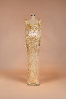 Sihëna Golden Starlight — champagne square-neck long-sleeve corset gown with gold crystal beadwork on sheer illusion base.