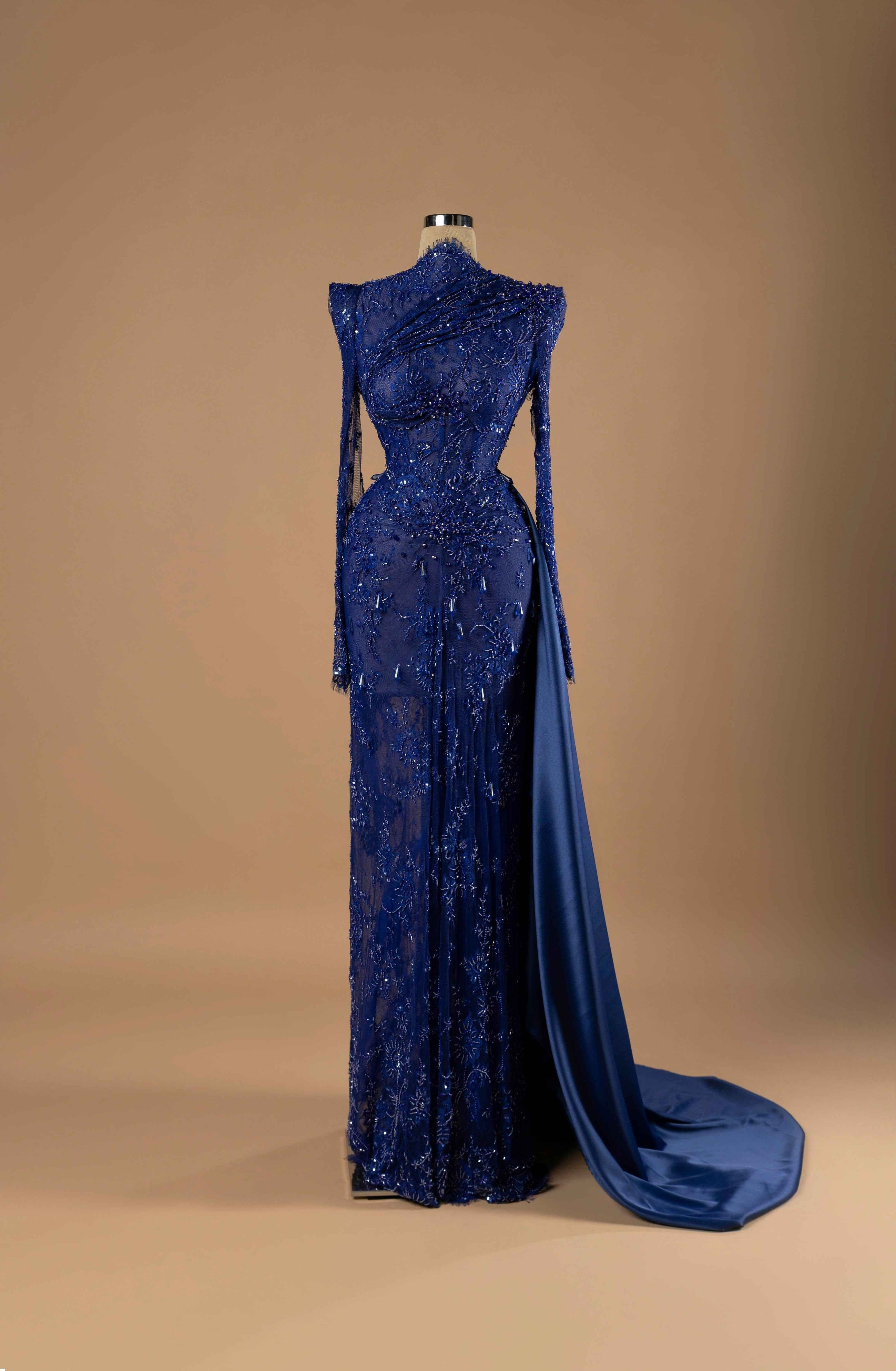Sihëna Sapphire Nocturne — navy high-neck long-sleeve column gown with beaded lace on sheer net, side cutouts and draped satin overskirt train.