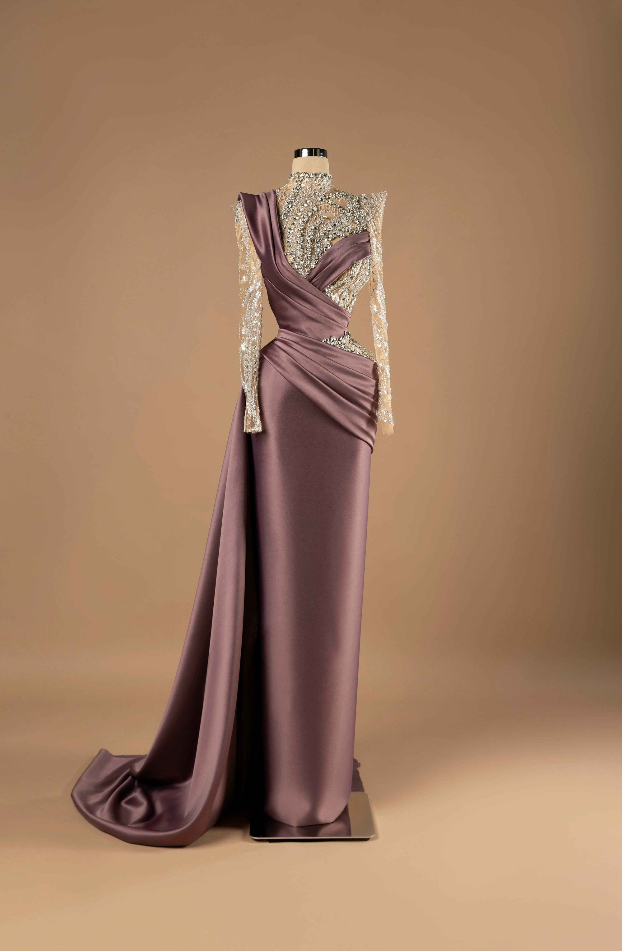 Sihëna Mulberry Opulence — mauve high-neck long-sleeve column evening gown with silver crystal-beaded illusion bodice and draped satin overskirt with slit.
