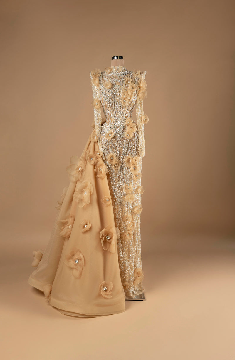 Sihëna Golden Blossom Cascade — champagne high-neck long-sleeve column evening gown with silver crystal beadwork, 3D organza florals and cascading overskirt train.