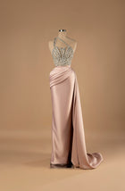 Sihëna Blush Radiance — blush one-shoulder column gown with a crystal-beaded sheer bodice and draped satin skirt with slit.