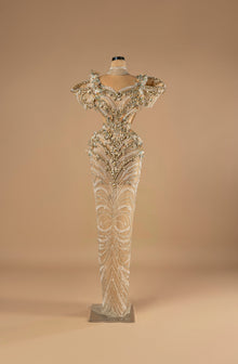 Sihëna Celestial Empress — ivory high-neck short-sleeve column gown with a pearl choker, gold beadwork and side cutouts.