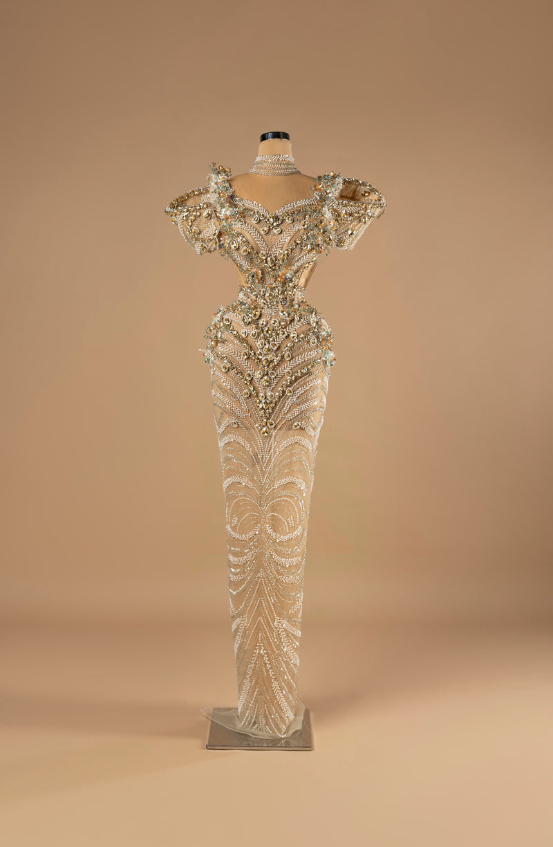 Sihëna Celestial Empress — ivory high-neck short-sleeve column gown with a pearl choker, gold beadwork and side cutouts.