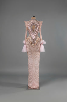 Sihëna Blush Enigma — blush high-neck long-sleeve column gown with pearl-crystal beadwork, a chest cutout and tulle cuffs.