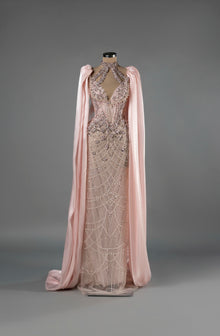 Sihëna Celestial Bloom — blush halter column gown with a deep keyhole, crystal-pearl beadwork on net and a chiffon cape.