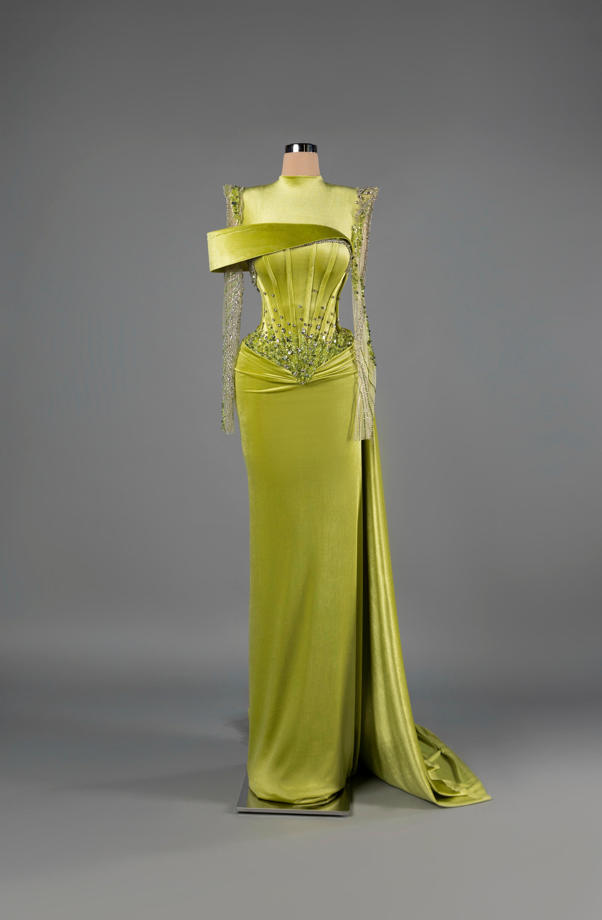 Sihëna Verdant Majesty — lime velvet high-neck long-sleeve column gown with a corset bodice, crystals and a high slit.