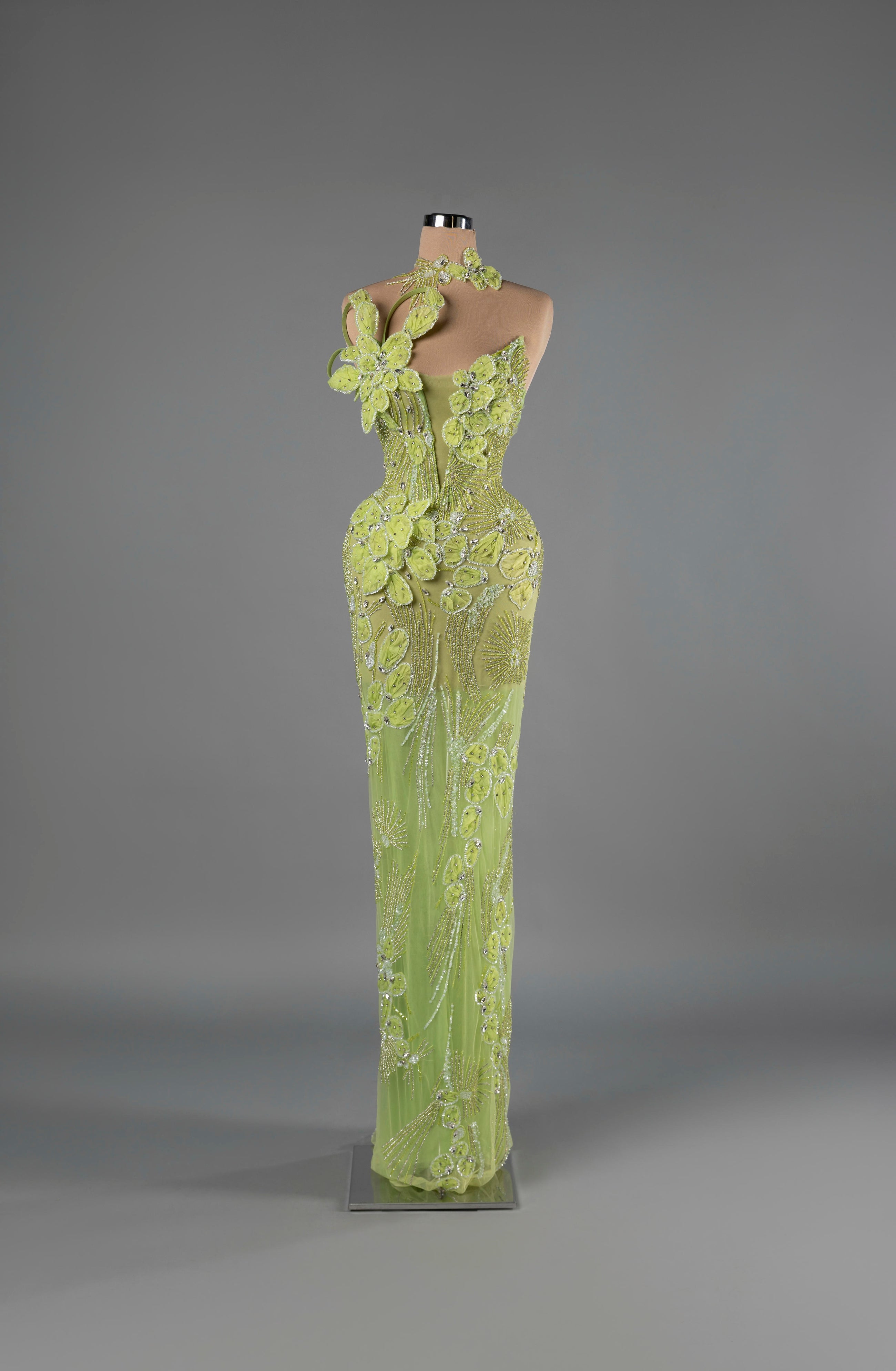 Sihëna Verdant Illusion — lime one-shoulder sleeveless column gown with 3D-floral appliqué and crystal beadwork on sheer net.