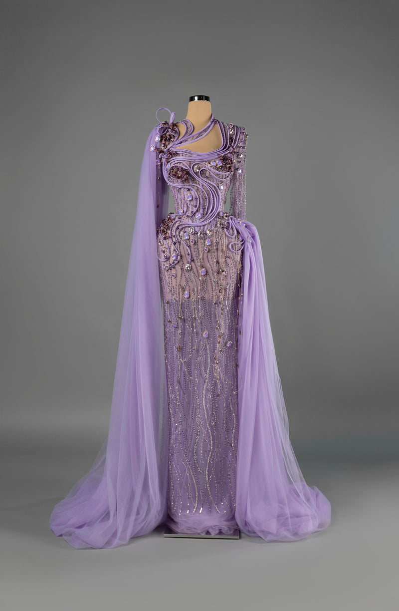 Sihëna Amethyst Mirage — lilac one-shoulder long-sleeve column gown with crystal beadwork on sheer tulle and a cape train.