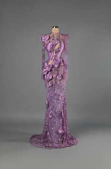 Sihëna Petal Chandelier — lilac high-neck long-sleeve mermaid gown with sculpted satin panels, 3D floral petals, pearl and sequin beadwork.