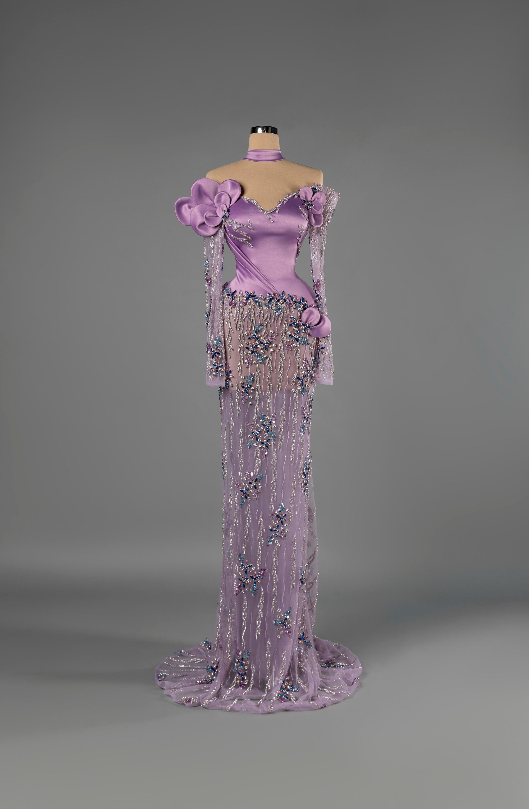 Sihëna Orchid Dewfall — lilac off-shoulder sweetheart mermaid gown in satin with choker collar, 3D floral appliqué and sheer beaded skirt with train.
