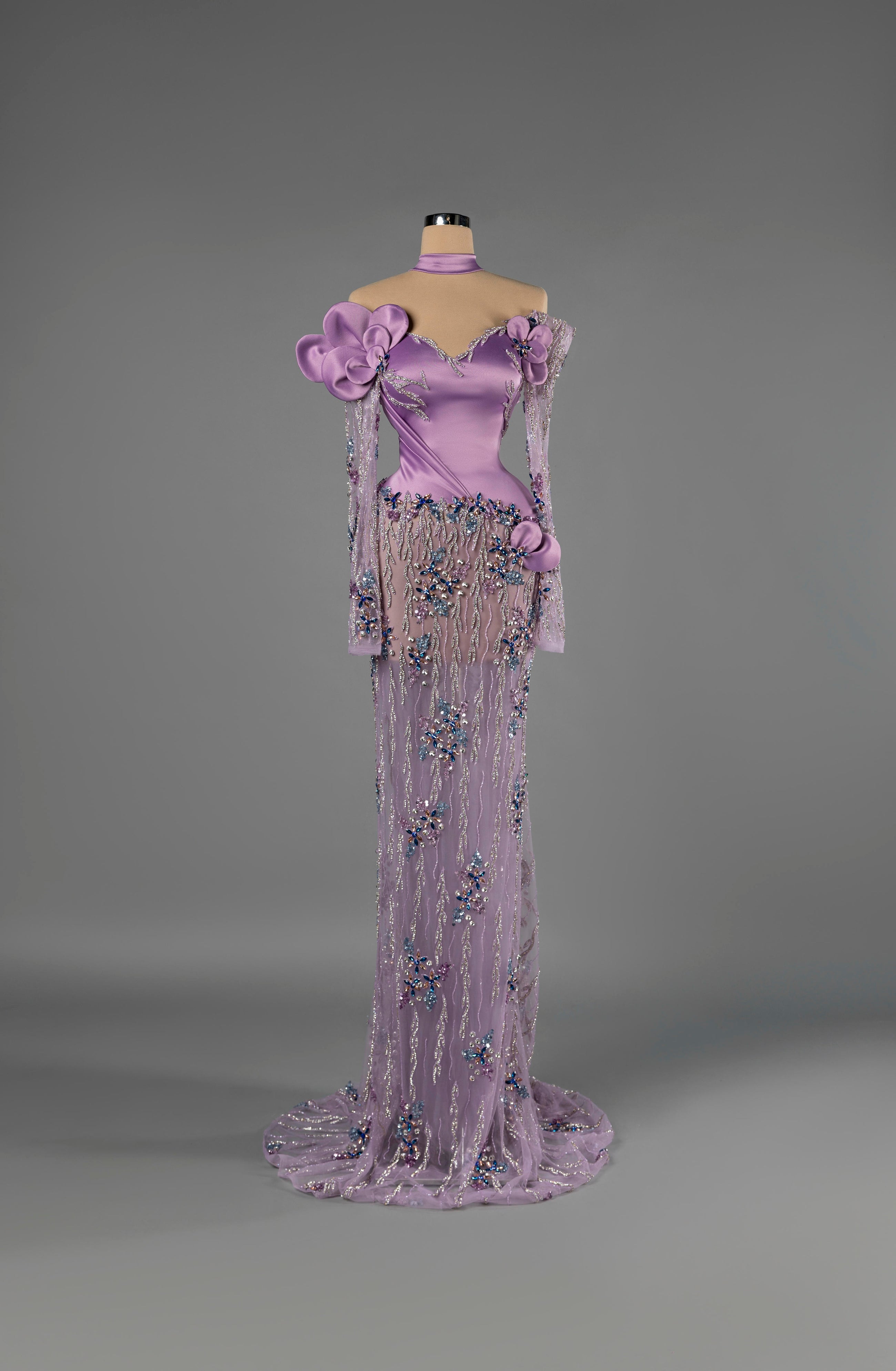 Sihëna Orchid Dewfall — lilac off-shoulder sweetheart mermaid gown in satin with choker collar, 3D floral appliqué and sheer beaded skirt with train.