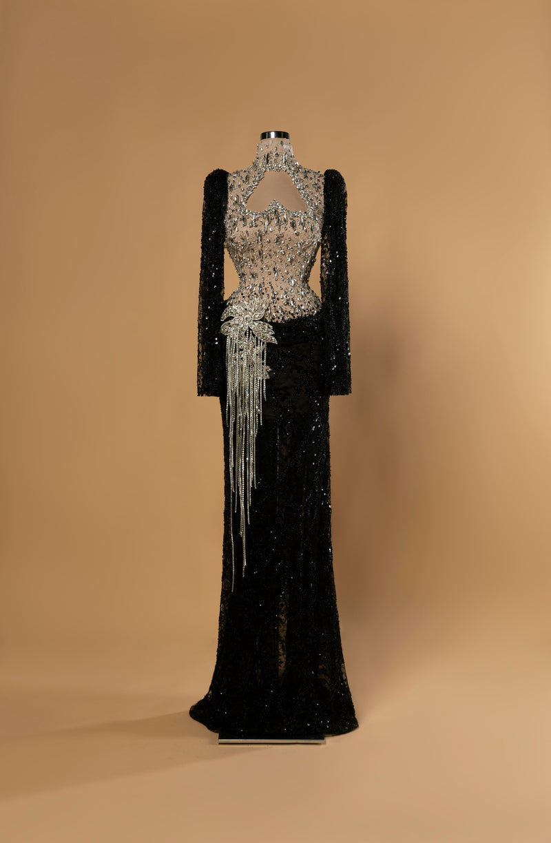 Sihëna Obsidian Glimmer — black high-neck long-sleeve column gown with silver crystal illusion bodice, black sequin skirt and crystal fringe.