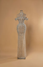 Sihëna Radiant Tapestry — silver high-neck halter off-shoulder mermaid gown with crystal and pearl beadwork and draped pearl swags.