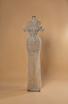 Sihëna Radiant Tapestry — silver high-neck halter off-shoulder mermaid gown with crystal and pearl beadwork and draped pearl swags.