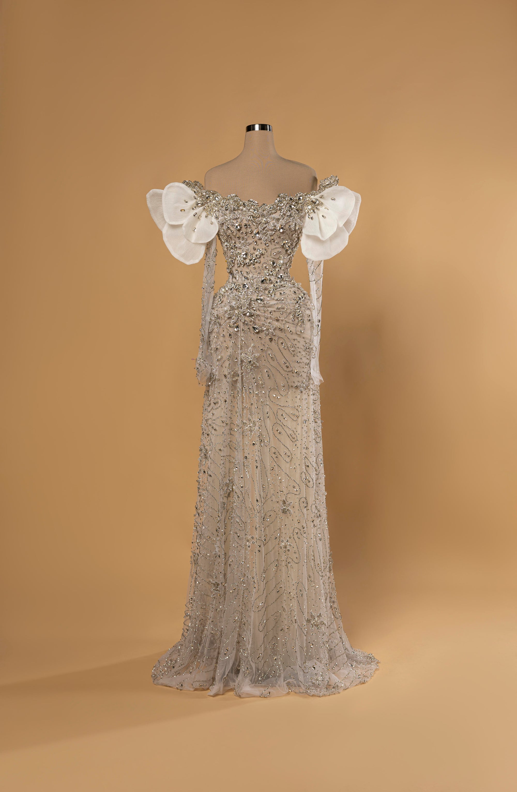 Sihëna Snow Petal Grace — ivory off-shoulder sweetheart mermaid gown with crystal beadwork, 3D petal shoulders and sheer beaded train.