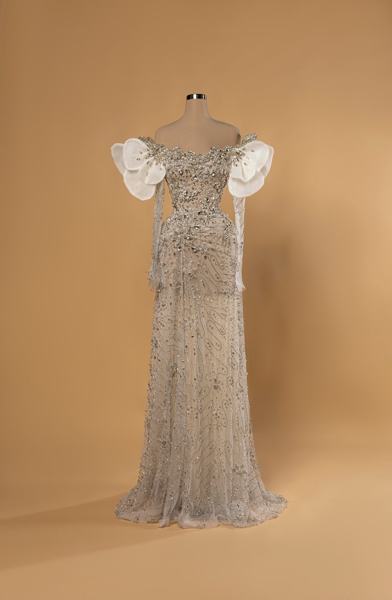 Sihëna Snow Petal Grace — ivory off-shoulder sweetheart mermaid gown with crystal beadwork, 3D petal shoulders and sheer beaded train.