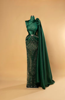 Sihëna Jade Ascendant — emerald high-neck one-shoulder column evening gown in satin with crystal illusion bodice, draped wrap and shoulder cape.