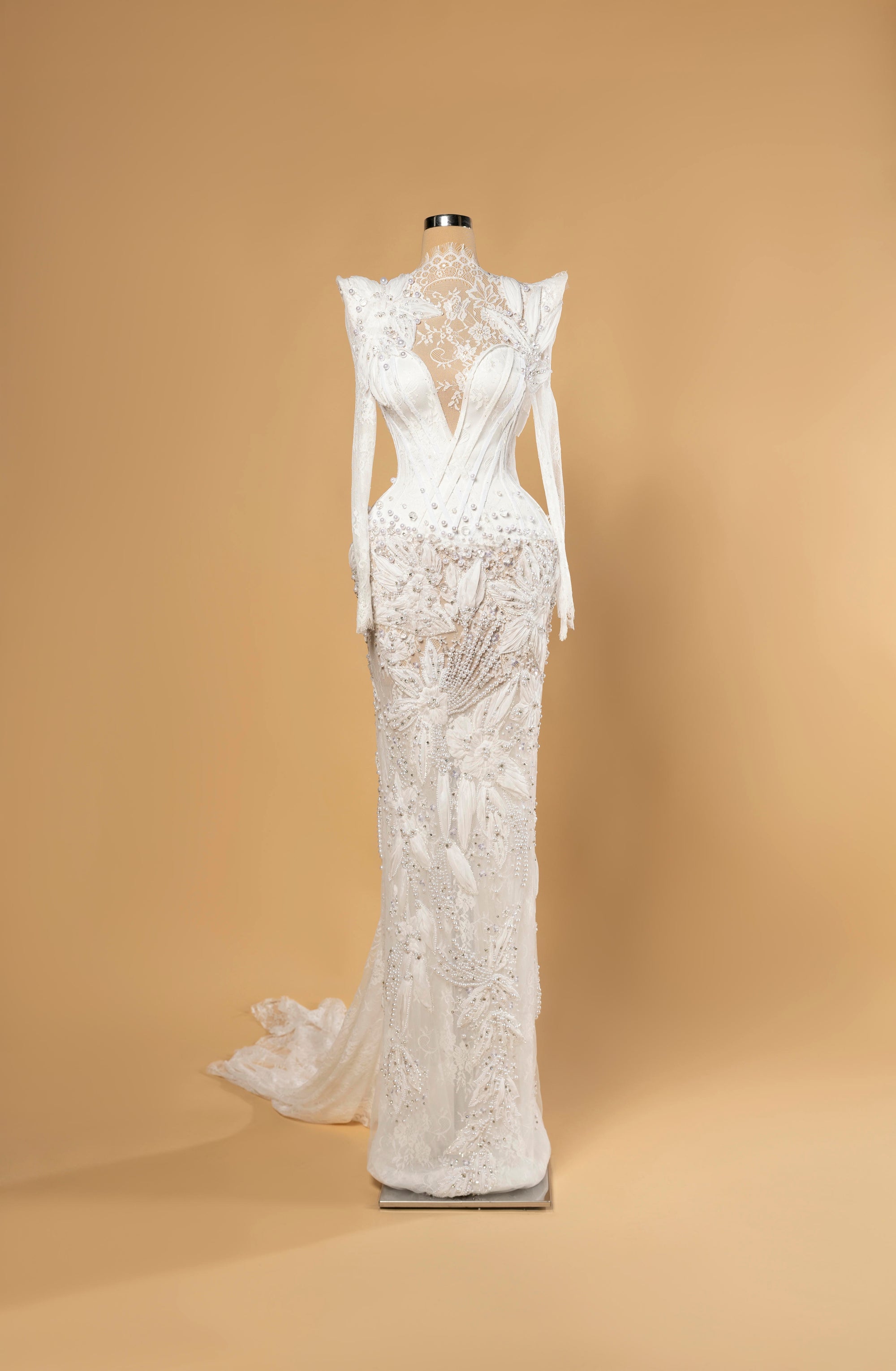 Sihëna Seraphine Lattice — ivory high-neck long-sleeve mermaid bridal gown in lace with pearl-feather 3D-florals and beaded illusion skirt.