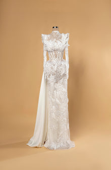 Sihëna Alabaster Halcyon — ivory high-neck long-sleeve mermaid bridal gown in lace with pearl-crystal corset, feathers and beaded sheer skirt.