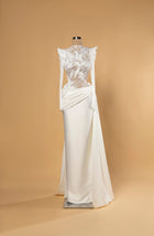 Sihëna Noor Draped Serenity — ivory high-neck long-sleeve column bridal gown in lace with pearl 3D-florals and draped matte skirt.