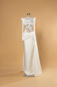 Sihëna Noor Draped Serenity — ivory high-neck long-sleeve column bridal gown in lace with pearl 3D-florals and draped matte skirt.