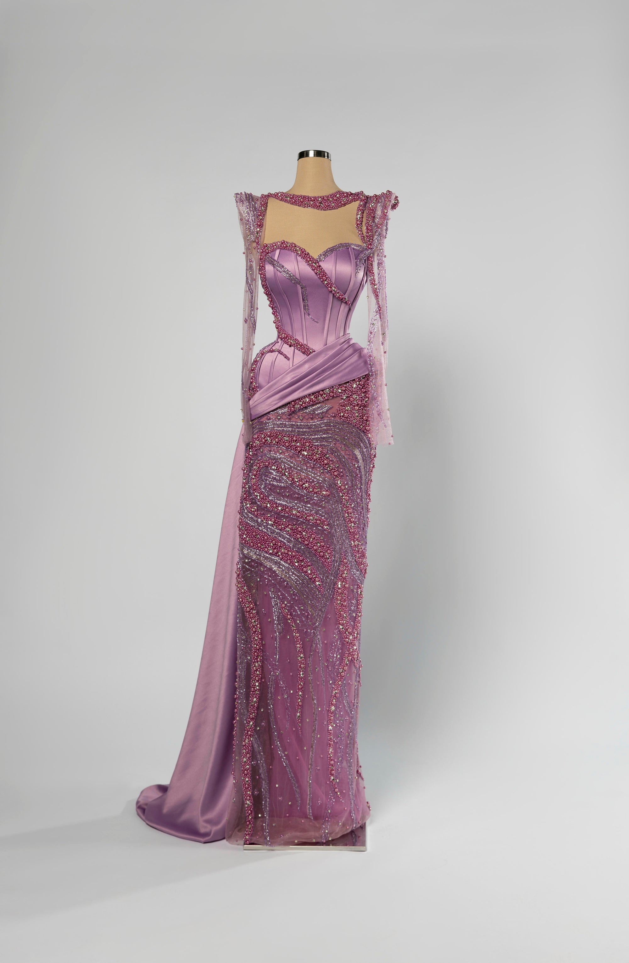 Sihëna Lilac Rhapsody — lilac high-neck long-sleeve mermaid evening gown with glossy satin corset, pearl beadwork and beaded sheer skirt.