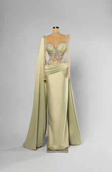 Sihëna Elysian Sage — sage-green high-neck long-sleeve column evening gown in satin with crystal-pearl illusion bodice and shoulder cape.