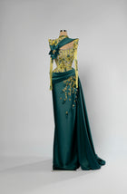 Sihëna Emerald Garland — emerald high-neck long-sleeve mermaid evening gown in satin with crystal illusion bodice and 3D-floral skirt.
