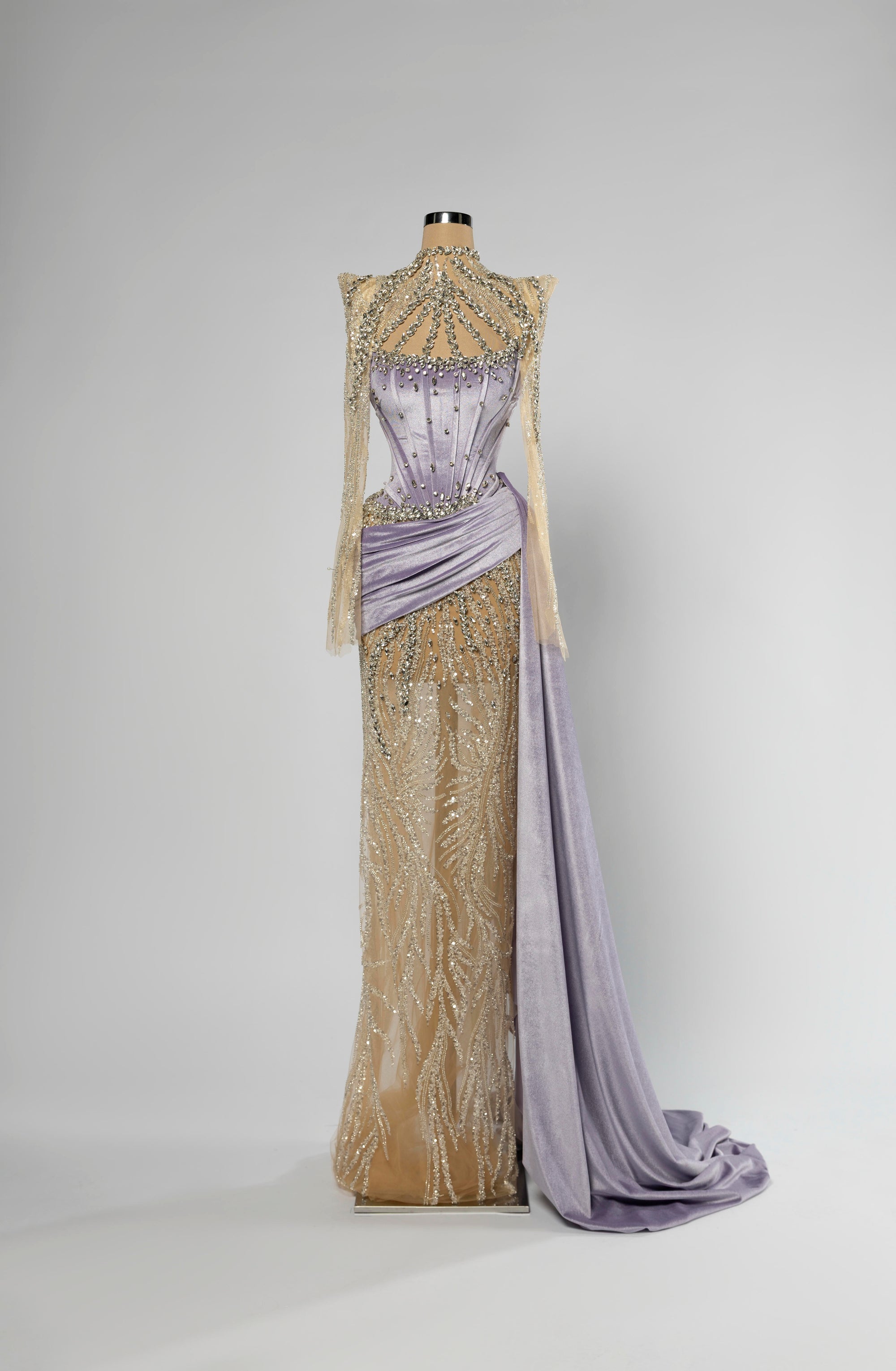 Sihëna Wisteria Halo — lilac high-neck long-sleeve mermaid gown with lilac satin corset, crystal beadwork, sheer illusion skirt and draped sash train.