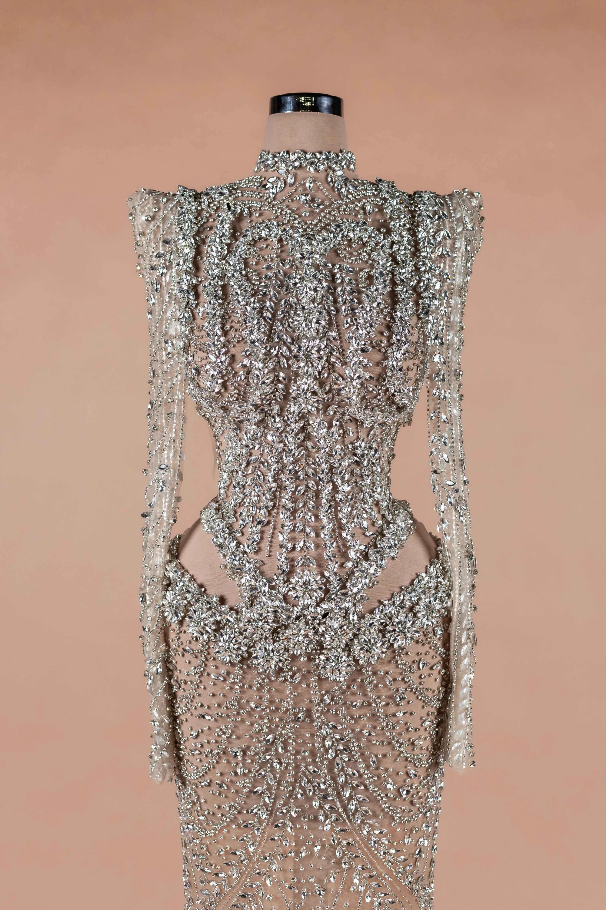 Sihëna Prismatic Cascade — silver high-neck long-sleeve column evening dress