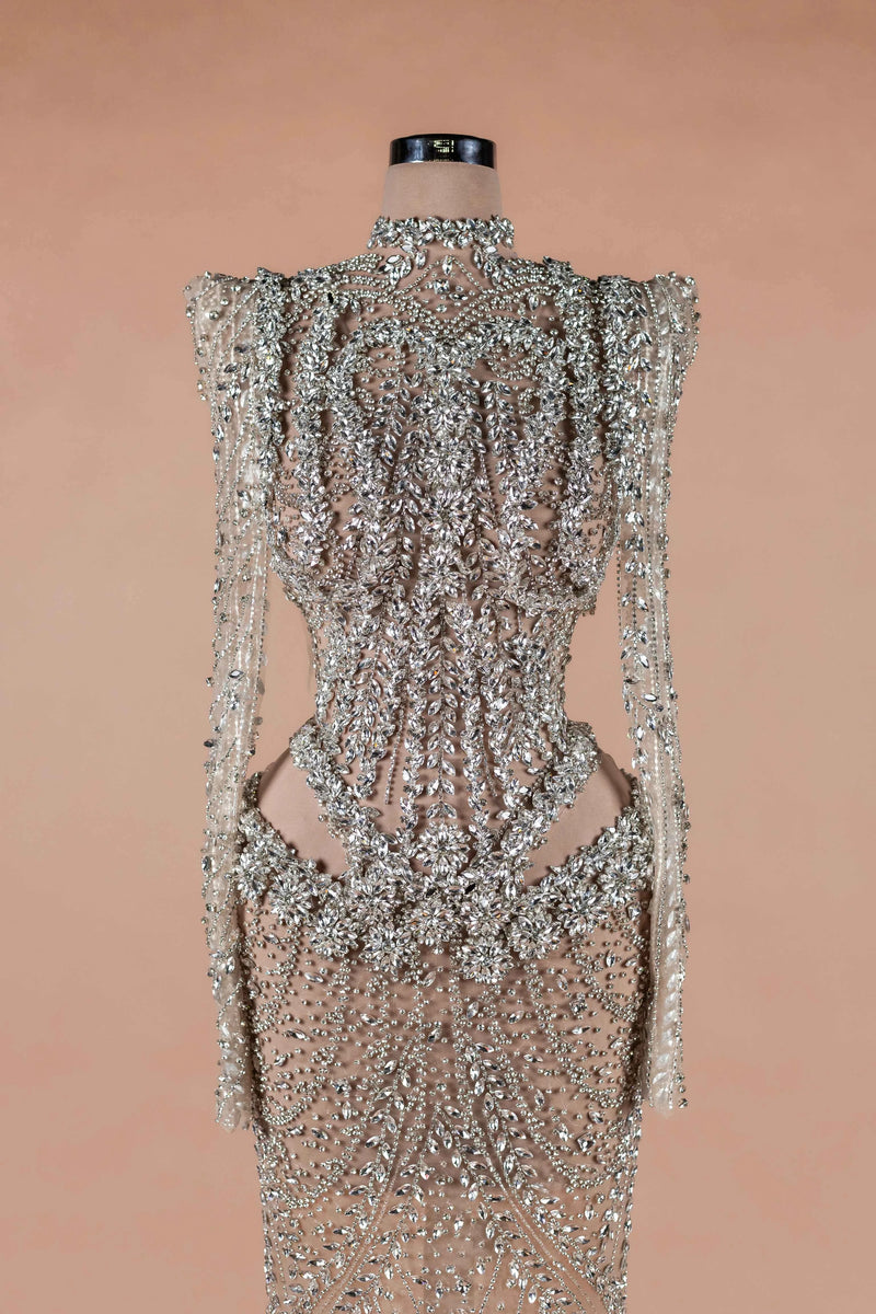 Sihëna Prismatic Cascade — silver high-neck long-sleeve column evening dress