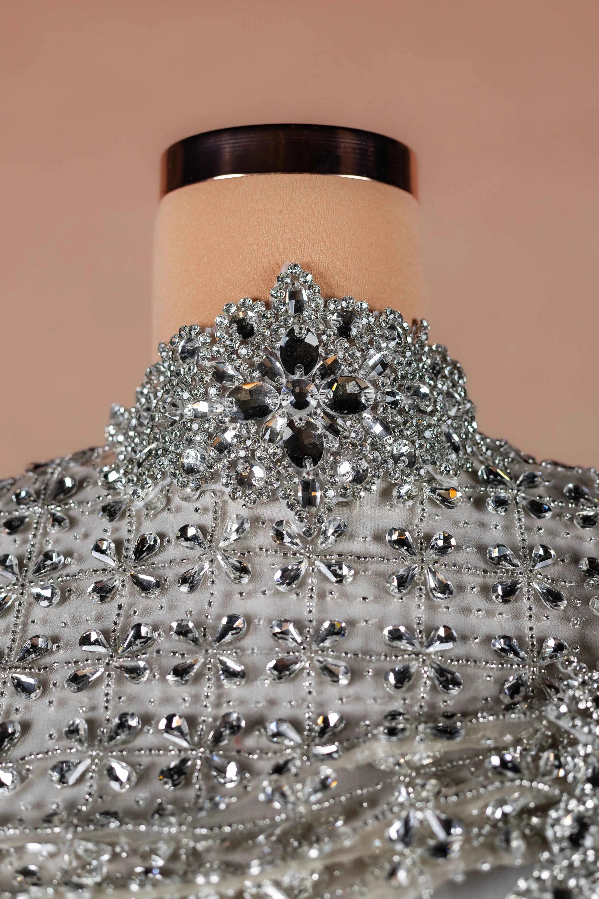Sihëna Ivory Armor — silver high-neck long-sleeve column evening dress