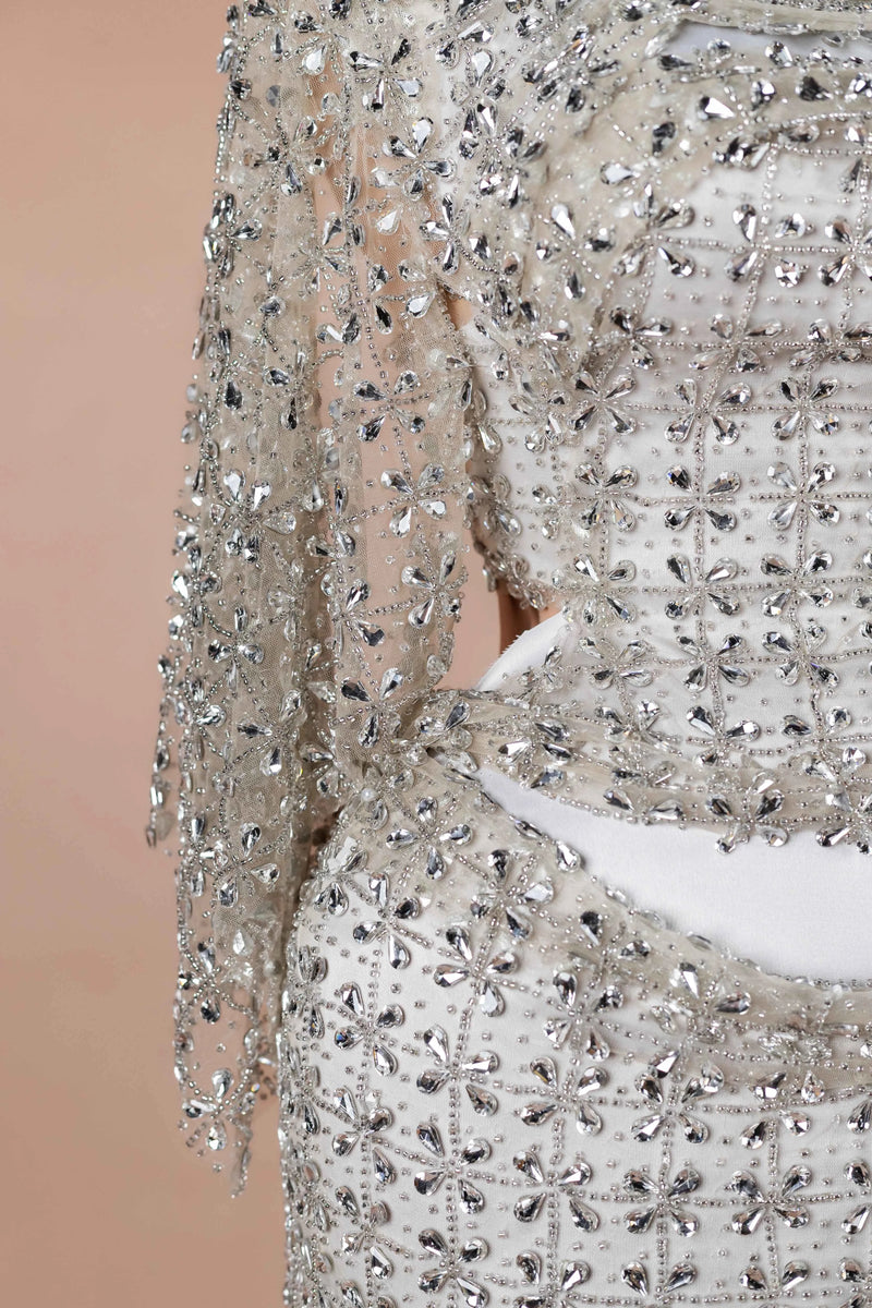 Sihëna Ivory Armor — silver high-neck long-sleeve column evening dress