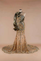 Sihëna Gilded Flora — gold sweetheart one-shoulder mermaid gown with gold floral lace-appliqué, crystal beadwork and metallic draped sleeve.